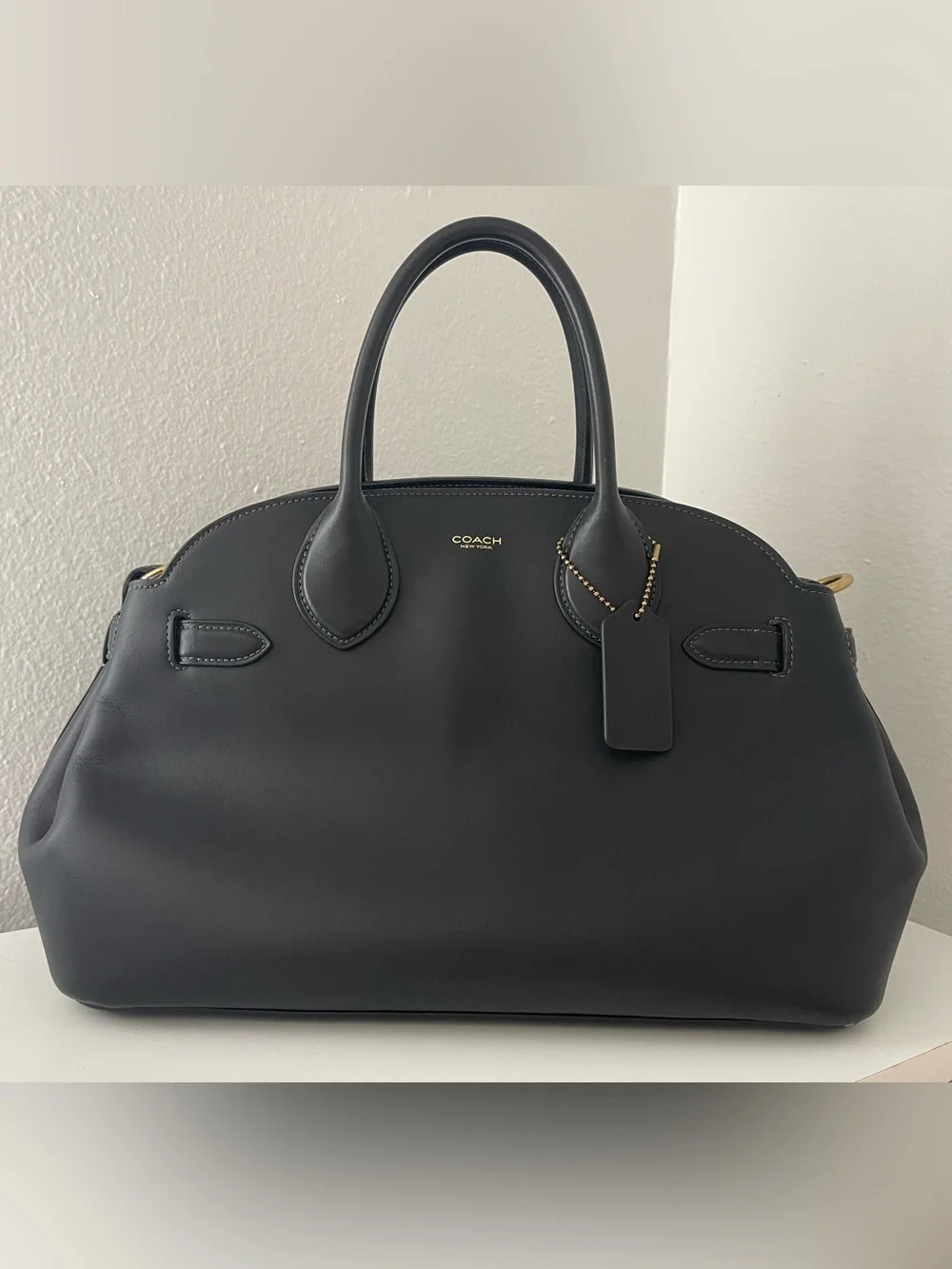 Coach Empire 35 in black glove tanned leather.